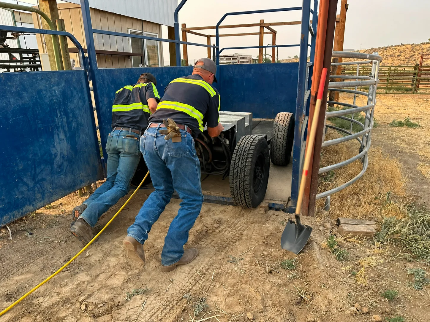 Scale service equipment being moved into a livestock handling area